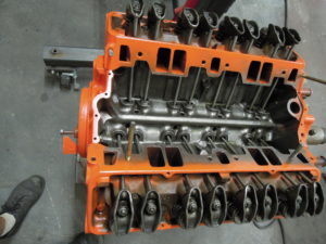 A close up of an engine block with many pistons