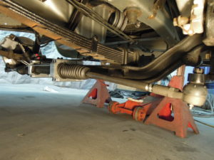 A car with the front end of it being worked on.