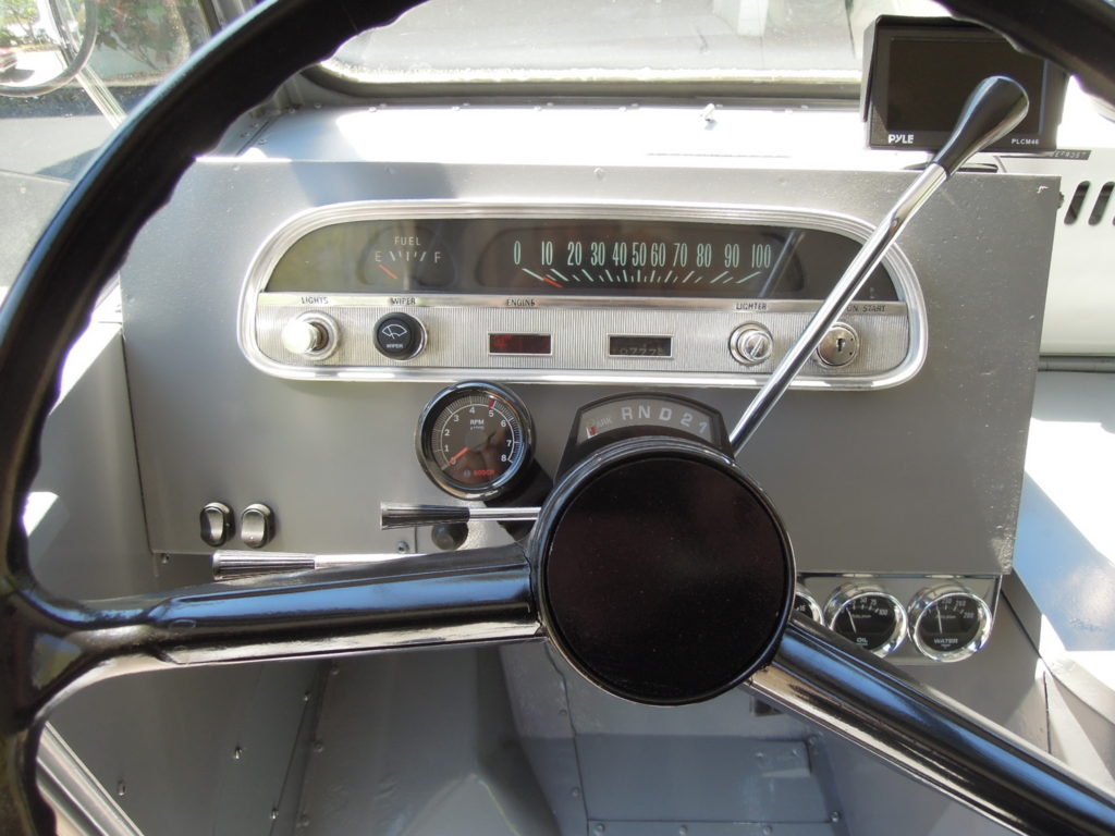 A close up of the dashboard and steering wheel