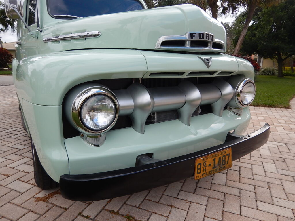 A close up of the front end of an old truck