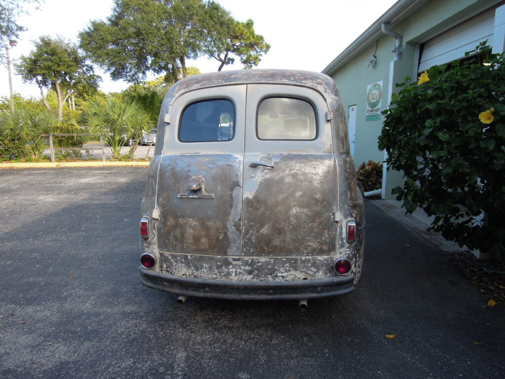 A van that is sitting in the street.